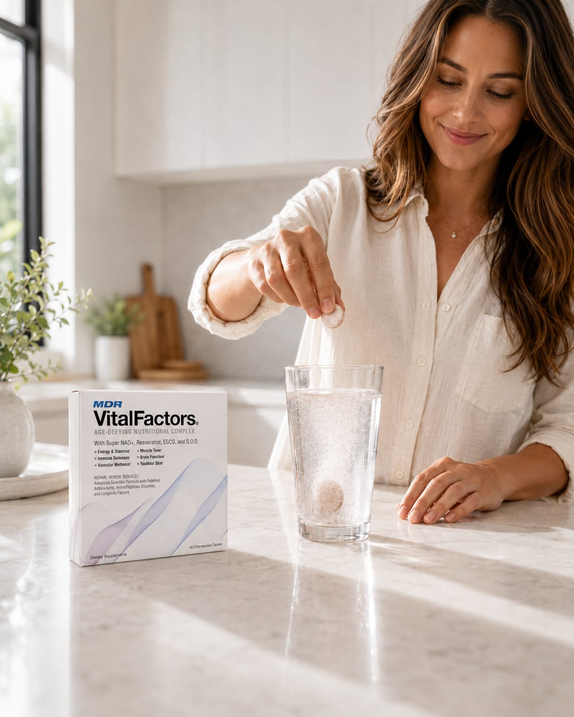 A woman dropping a VitalFactors effervescent tablet into a glass of water.